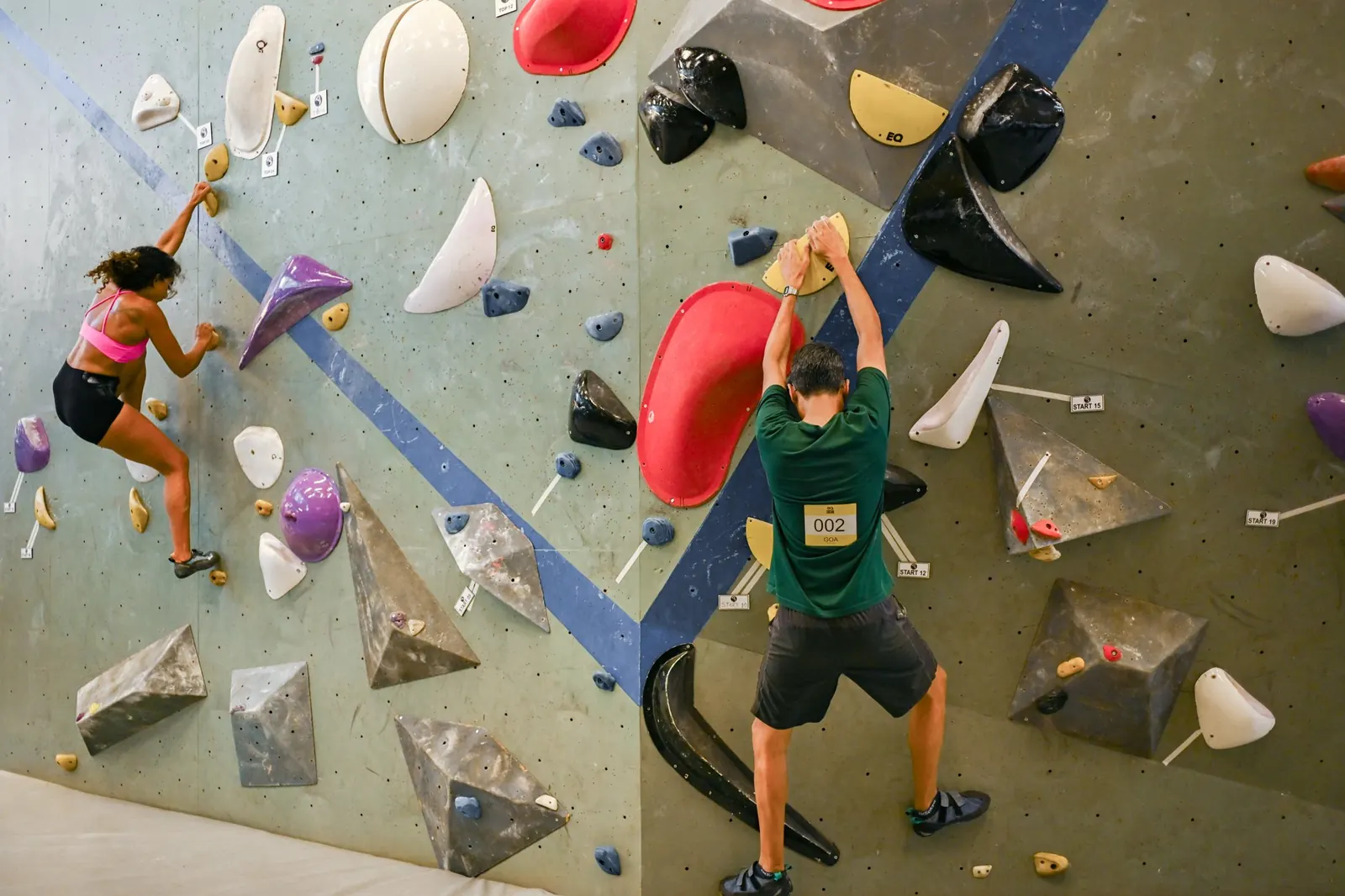 Climbers on the bouldering wall at Equilibrium Climbing in Anjuna, North Goa