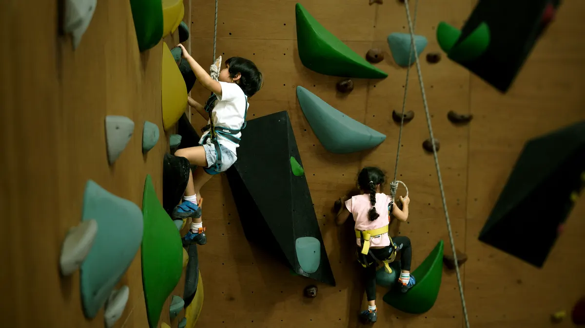 A child climbing in a kids programme at Equilibrium